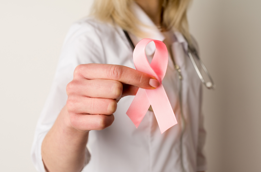 doctor holding pink ribbon
