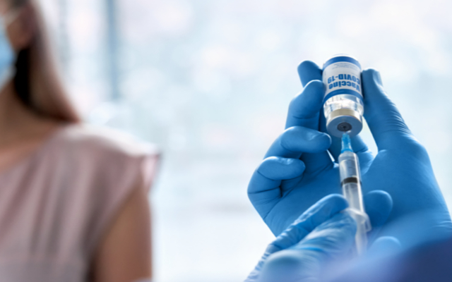 woman receiving vaccine