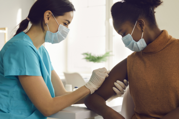 woman receiving vaccine