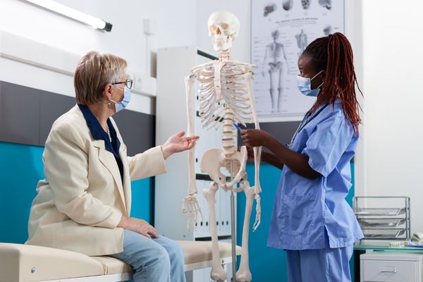 explaining body structure to older female patient