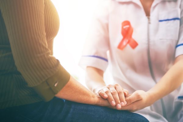 female patient comforted by doctor